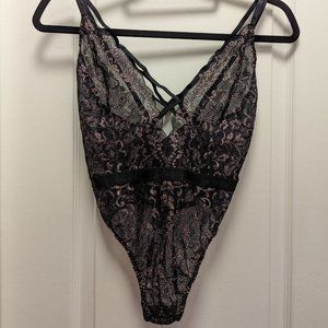 Black lace bodysuit with pink shimmer details (Medium)